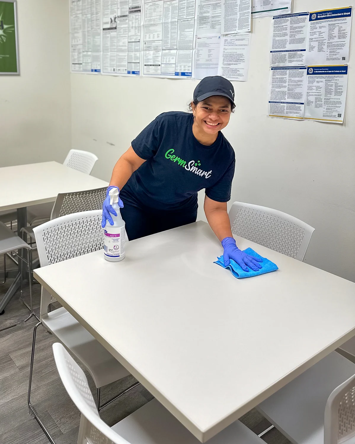GermSmart cleaner wiping and sanitizing a shared commercial table